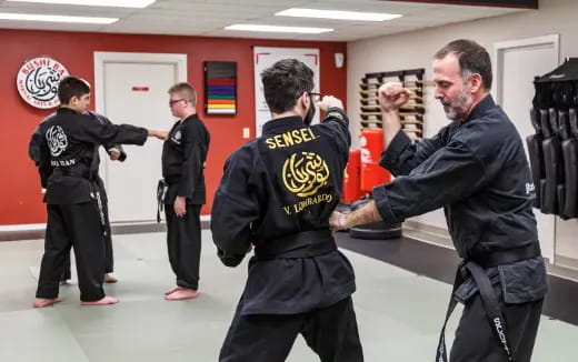 a group of men in black fighting
