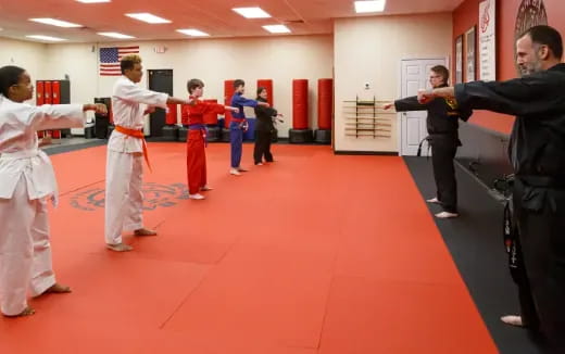a group of people in karate uniforms