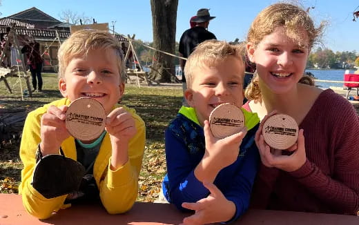a group of kids holding round objects