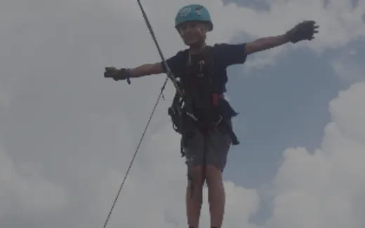a person wearing a helmet and harness