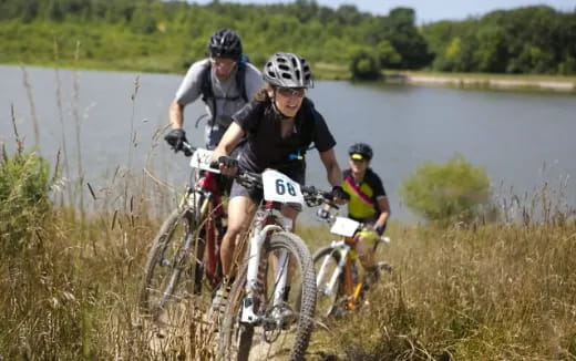 a group of people riding bikes