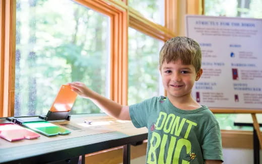 a boy sitting at a desk