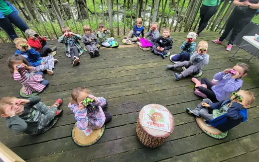 a group of people sitting on the ground