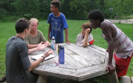 a group of people playing a board game