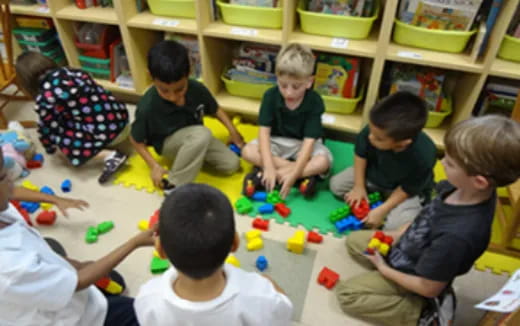 a group of children playing with toys