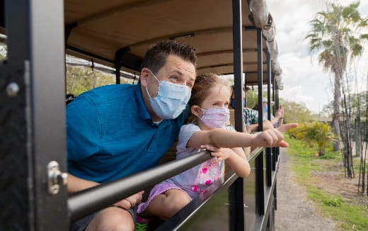 a man and a child in a vehicle