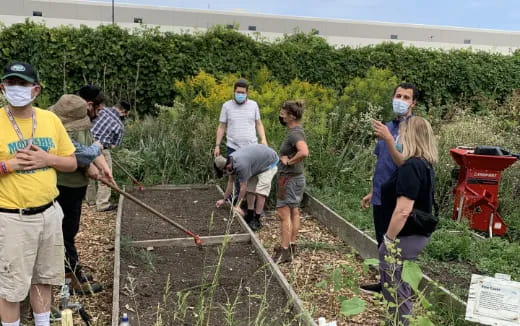 a group of people working outside