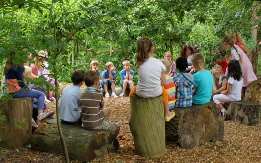 a group of people sitting on rocks