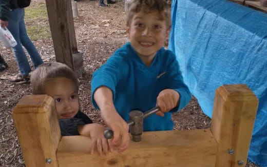 a couple of boys playing with a toy