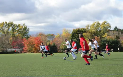 a group of people playing football
