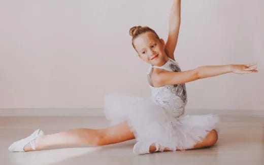 a person in white ballet outfit