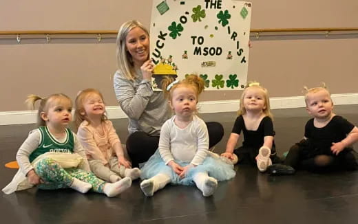 a group of children sitting on the floor