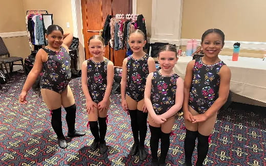 a group of girls posing for a picture
