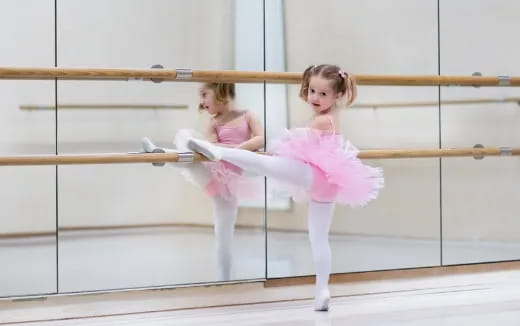 a couple of girls in pink outfits