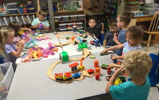 a group of children playing with toys