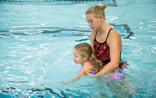 a woman and a child in the water