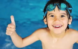 a child with a thumbs up