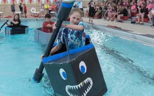 a child riding a toy boat