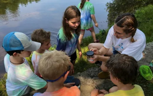 a group of children playing in the water