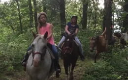 a group of people riding horses