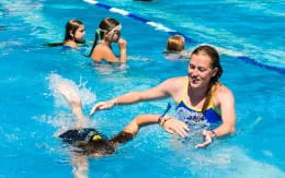 a group of people in a pool