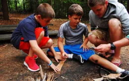 a group of people kneeling on the ground