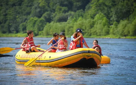 a group of people in a canoe