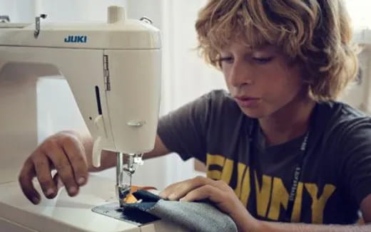 a young boy using a computer