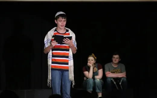 a person standing on a stage