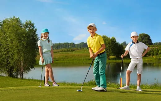 a group of people playing golf