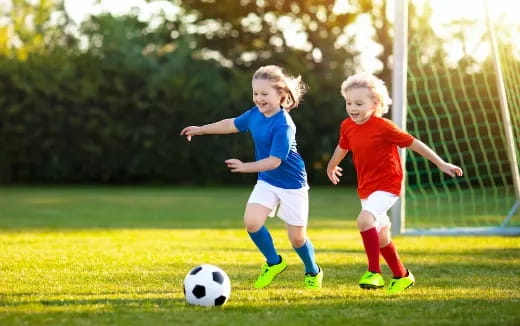 kids playing football on a field