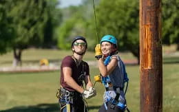 a person and a boy on a swing