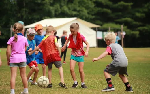 a group of kids playing football