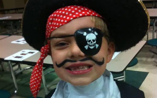 a boy with a mask on his face