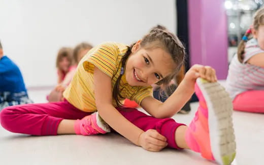 a young girl lying on the floor