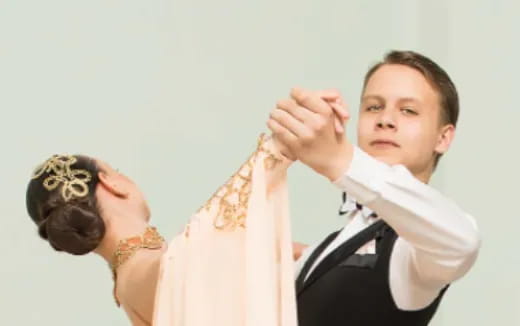 a boy and a girl holding hands