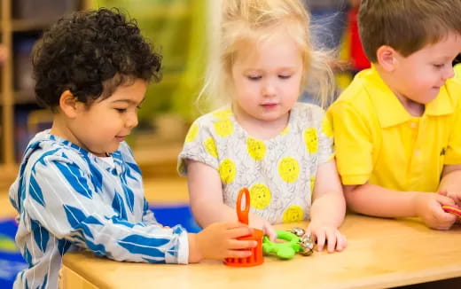 a group of children playing with toys