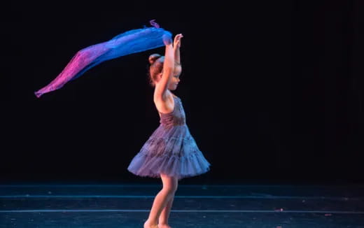 a woman dancing on a stage