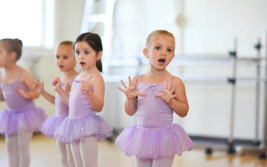 a group of girls in dresses