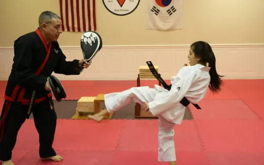 a man and a woman in karate uniforms