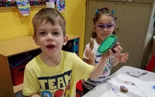 a boy and girl wearing glasses
