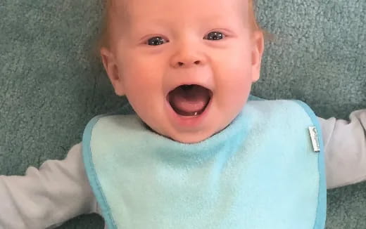 a baby with a surprised expression