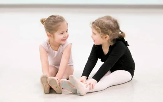 a woman and a child sitting on the floor