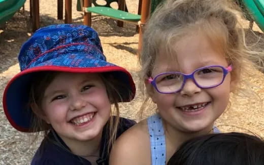 a couple of children wearing hats