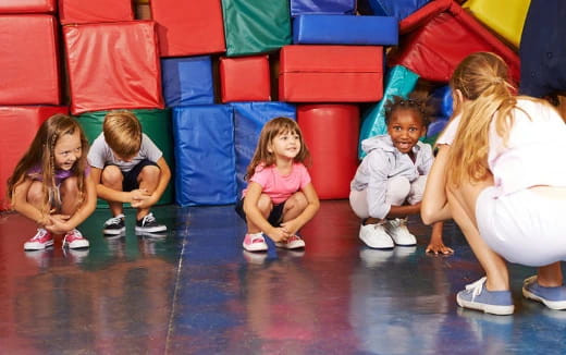 a group of children sitting on the floor