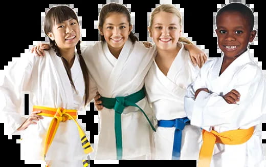a group of children in karate uniforms