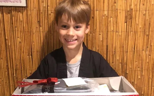 a boy smiling at the camera
