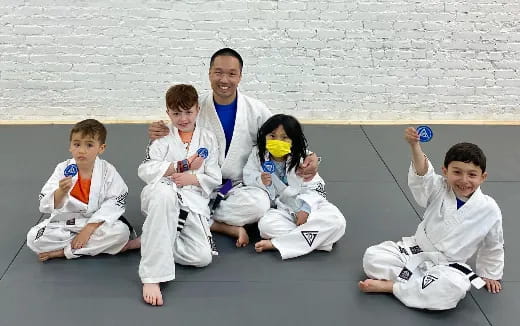a group of people in karate uniforms