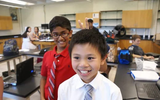 a couple of boys posing for the camera