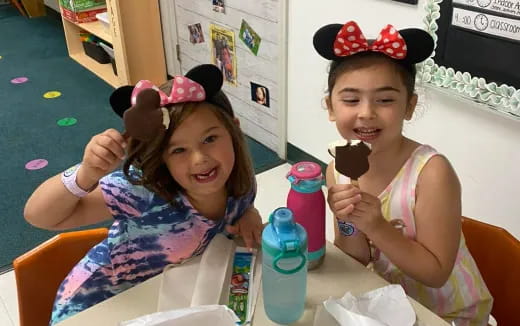 a couple of girls eating ice cream